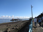 SX24873 Chris and Jenni walking towards Mumbles Pier.jpg